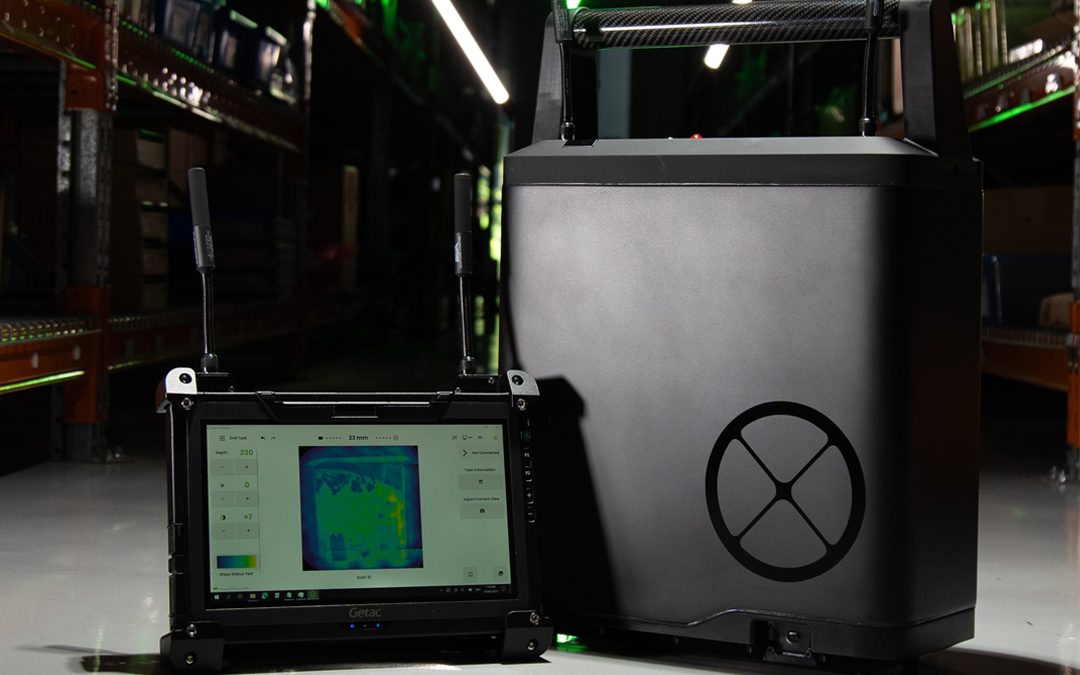 The Argus X-ray Camera next to a tablet screen